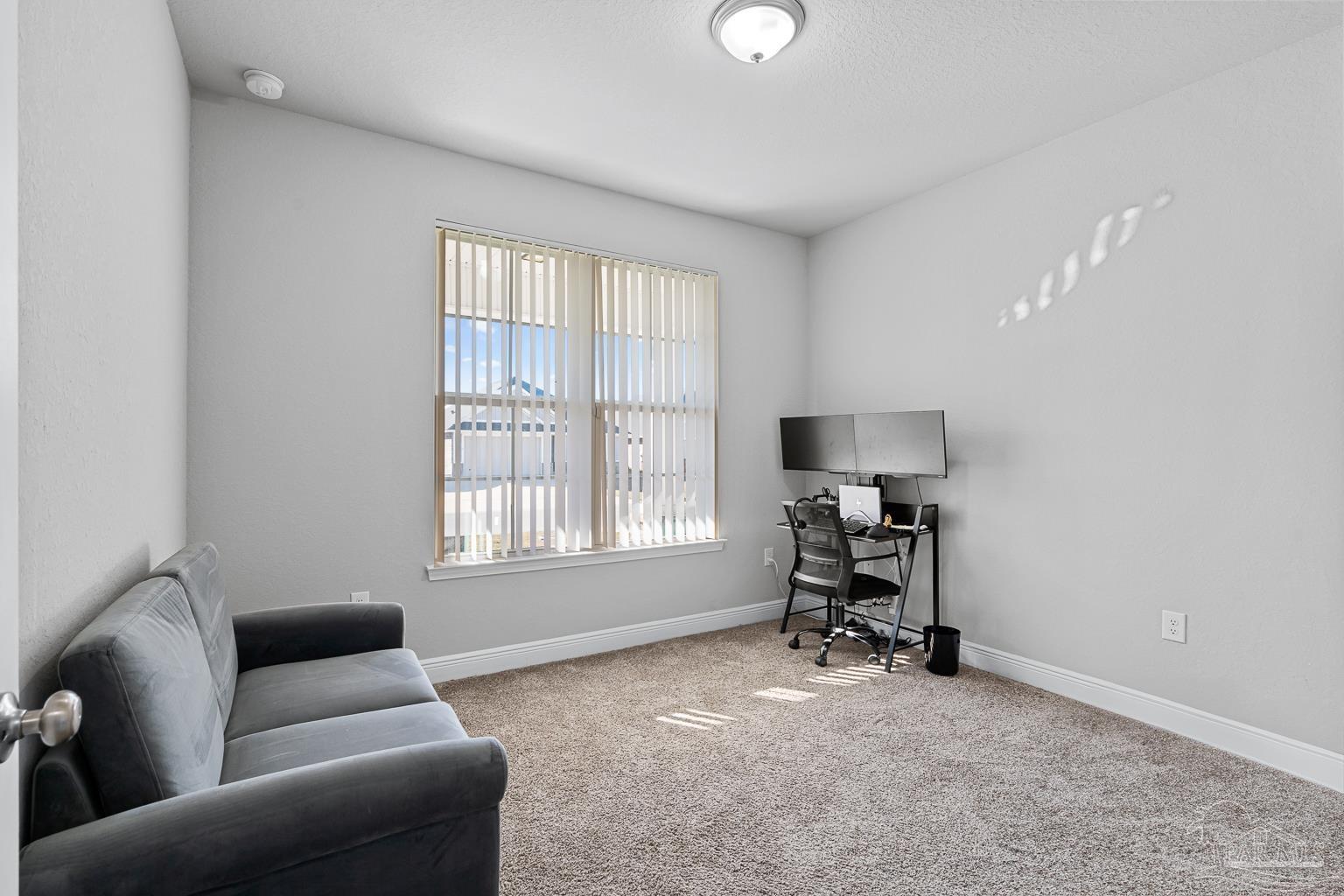 3838 Ranch Road Pace, FL 32571 - Photo 28 of 40 a living room with furniture and a window