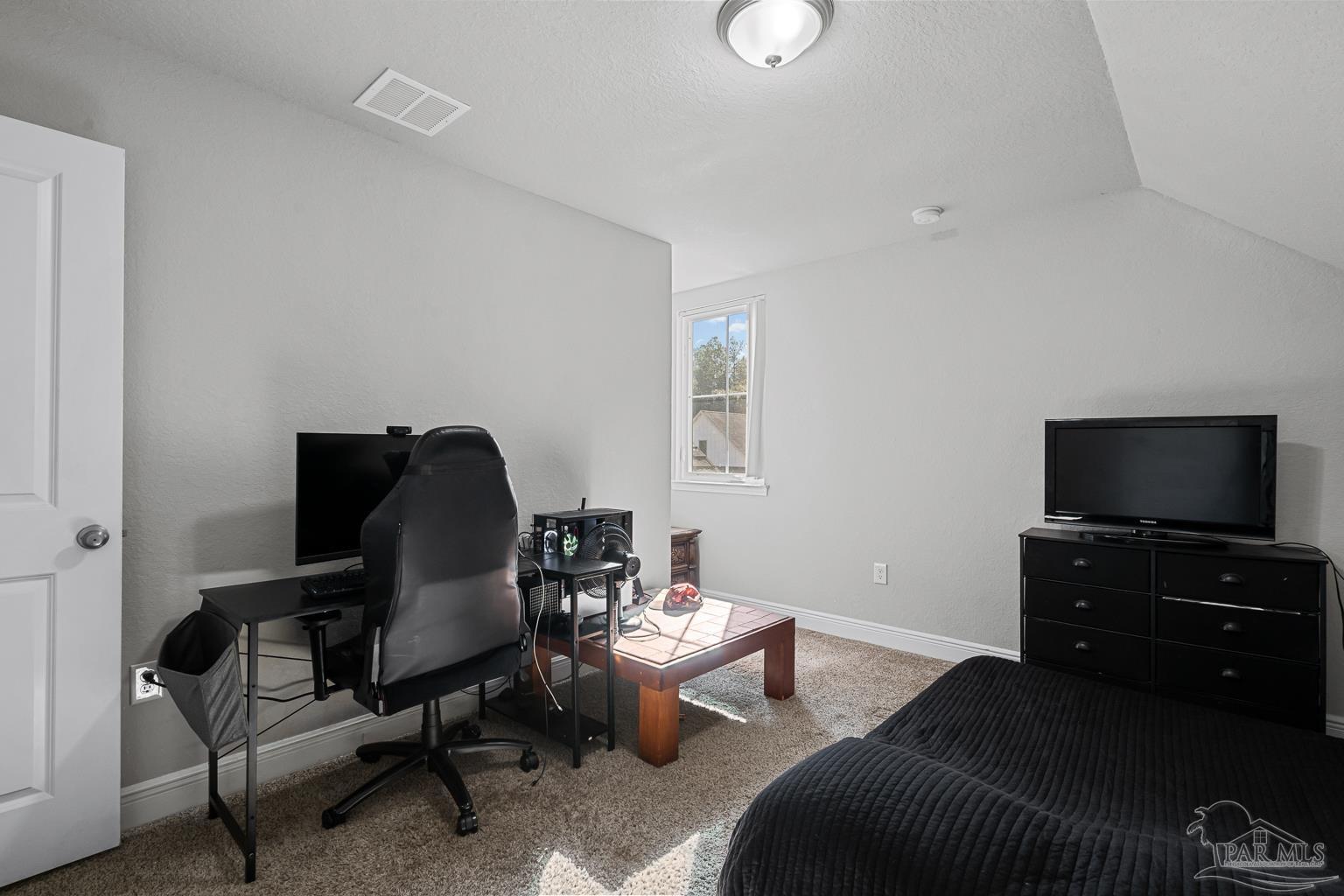 3838 Ranch Road Pace, FL 32571 - Photo 31 of 40 a living room with furniture and a flat screen tv