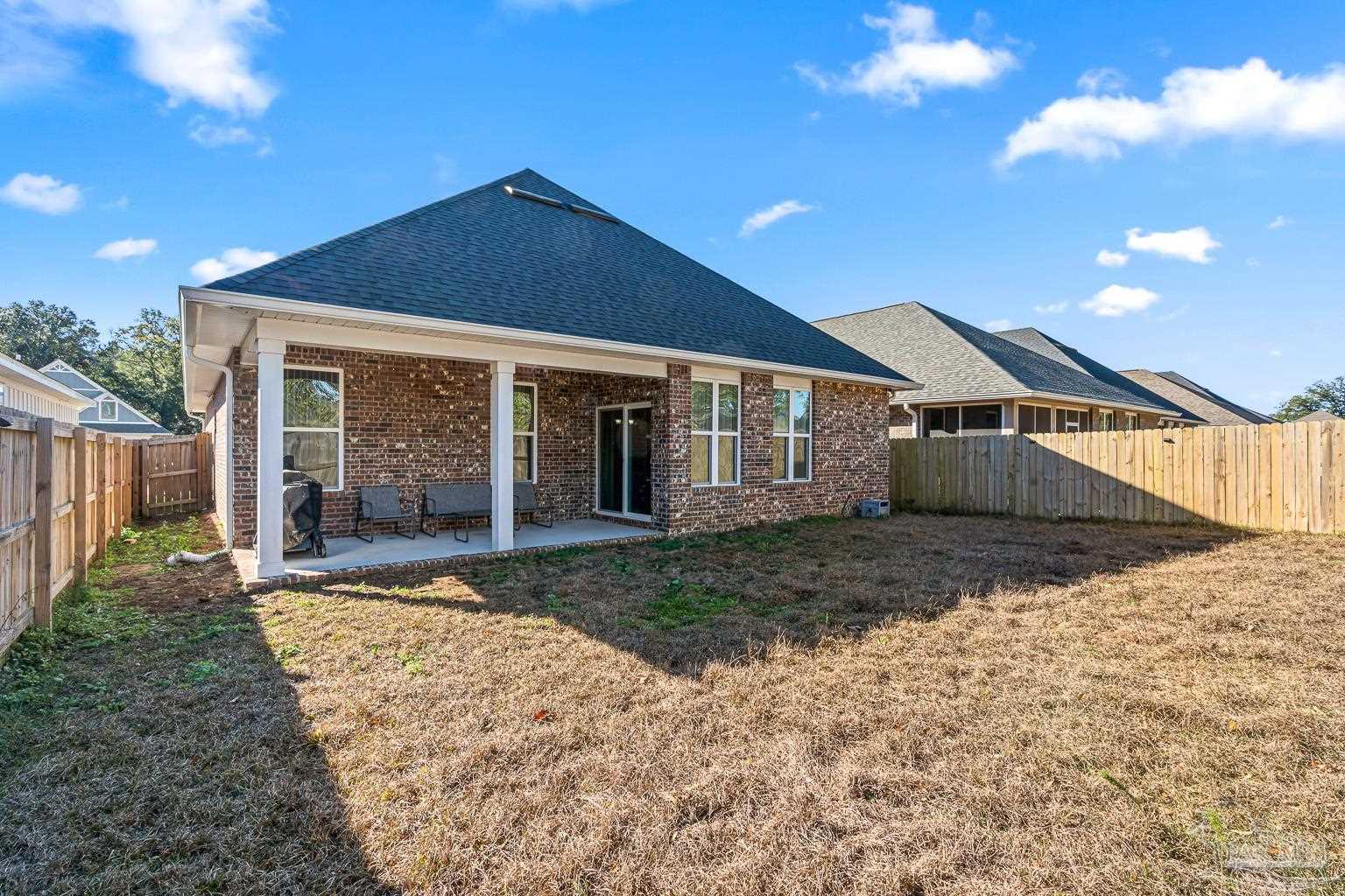 3838 Ranch Road Pace, FL 32571 - Photo 38 of 40 a view of a house with a yard