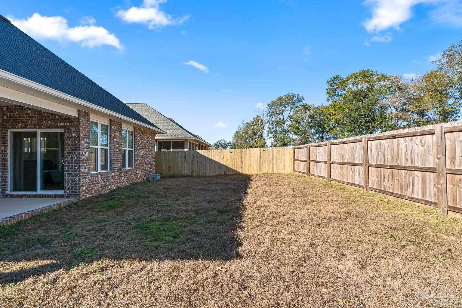 3838 Ranch Road Pace, FL 32571 - Photo 38 of 42 a view of backyard of house