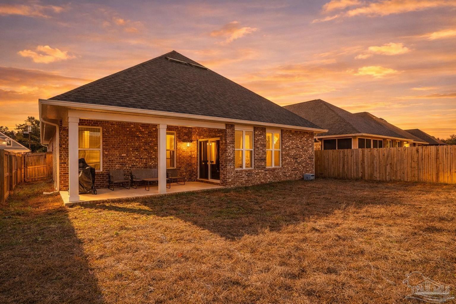 3838 Ranch Road Pace, FL 32571 - Photo 39 of 42 a front view of a house with a yard