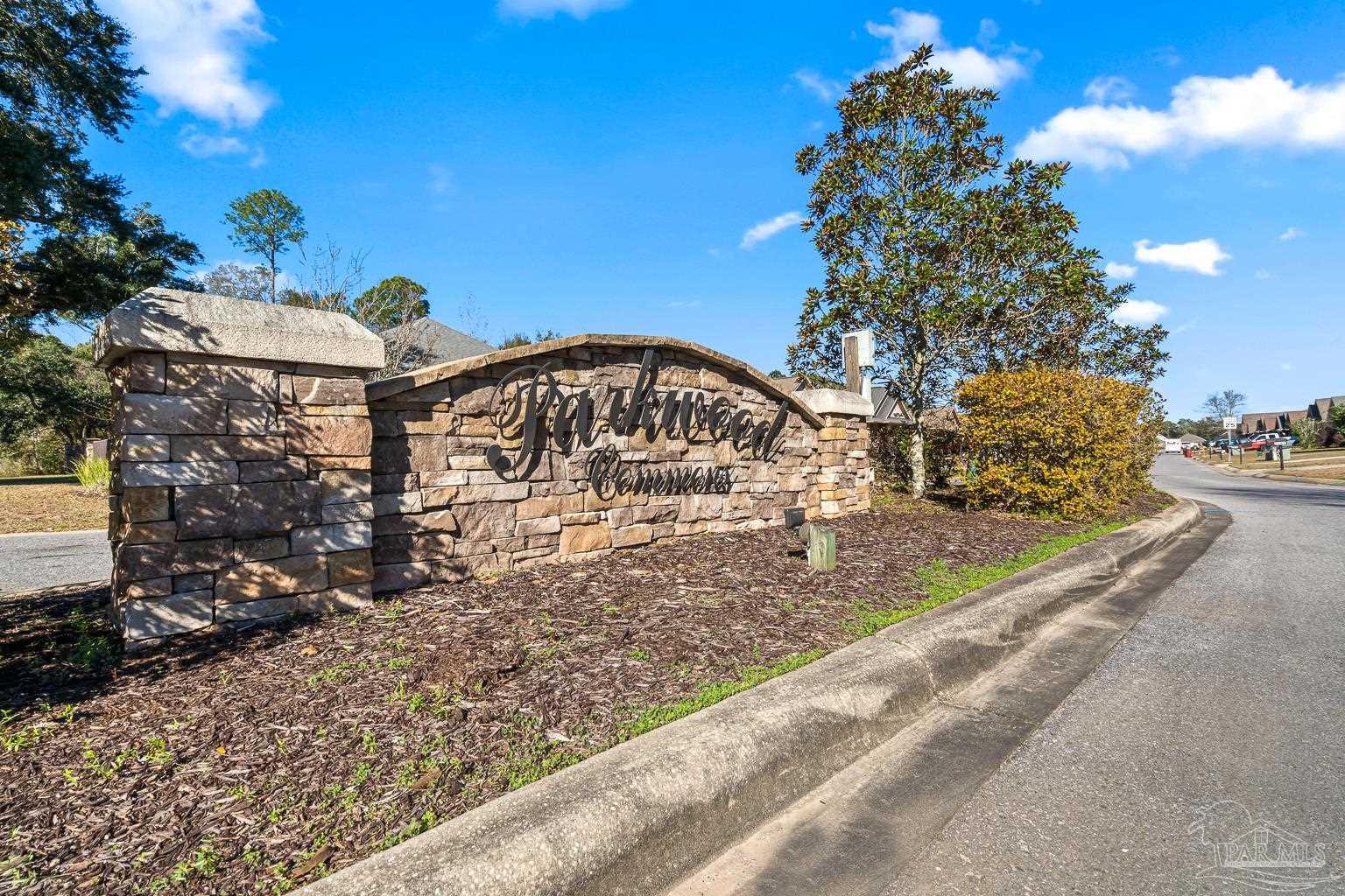 3838 Ranch Road Pace, FL 32571 - Photo 42 of 42 a view of a street with a building in the background