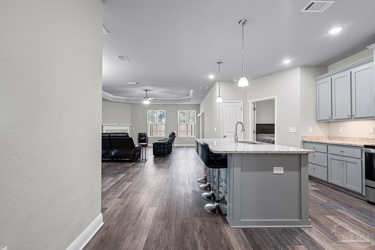 3838 Ranch Road Pace, FL 32571 - Photo 7 of 40 a kitchen with counter space cabinets and appliances