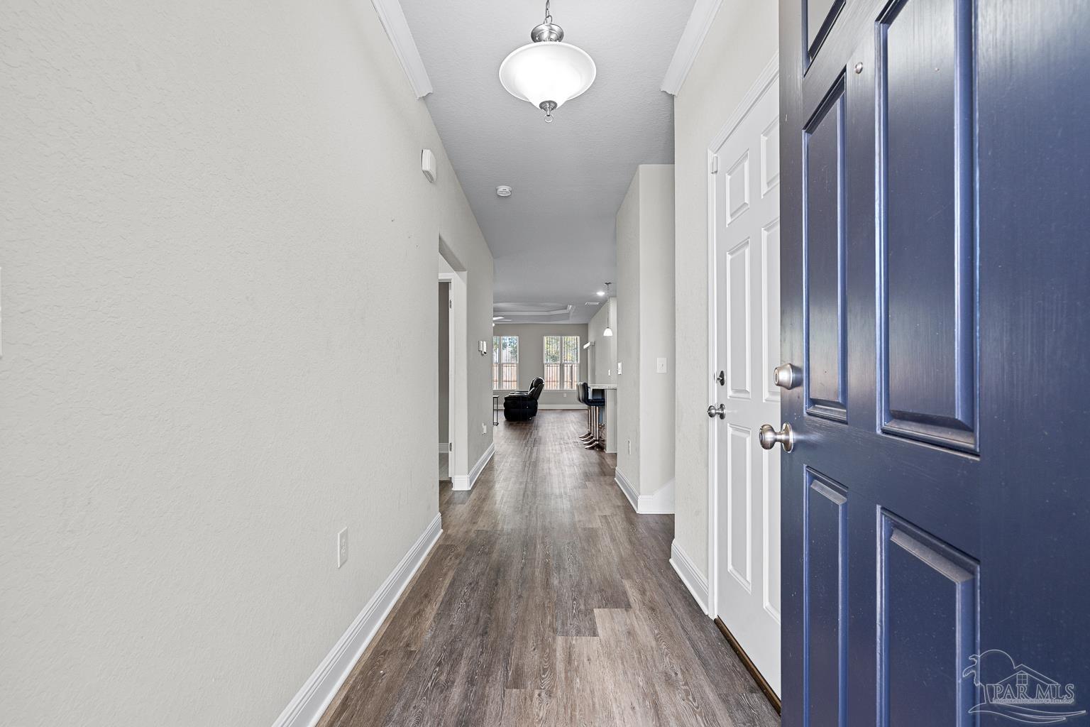 3838 Ranch Road Pace, FL 32571 - Photo 8 of 42 a view of a hallway with wooden floor