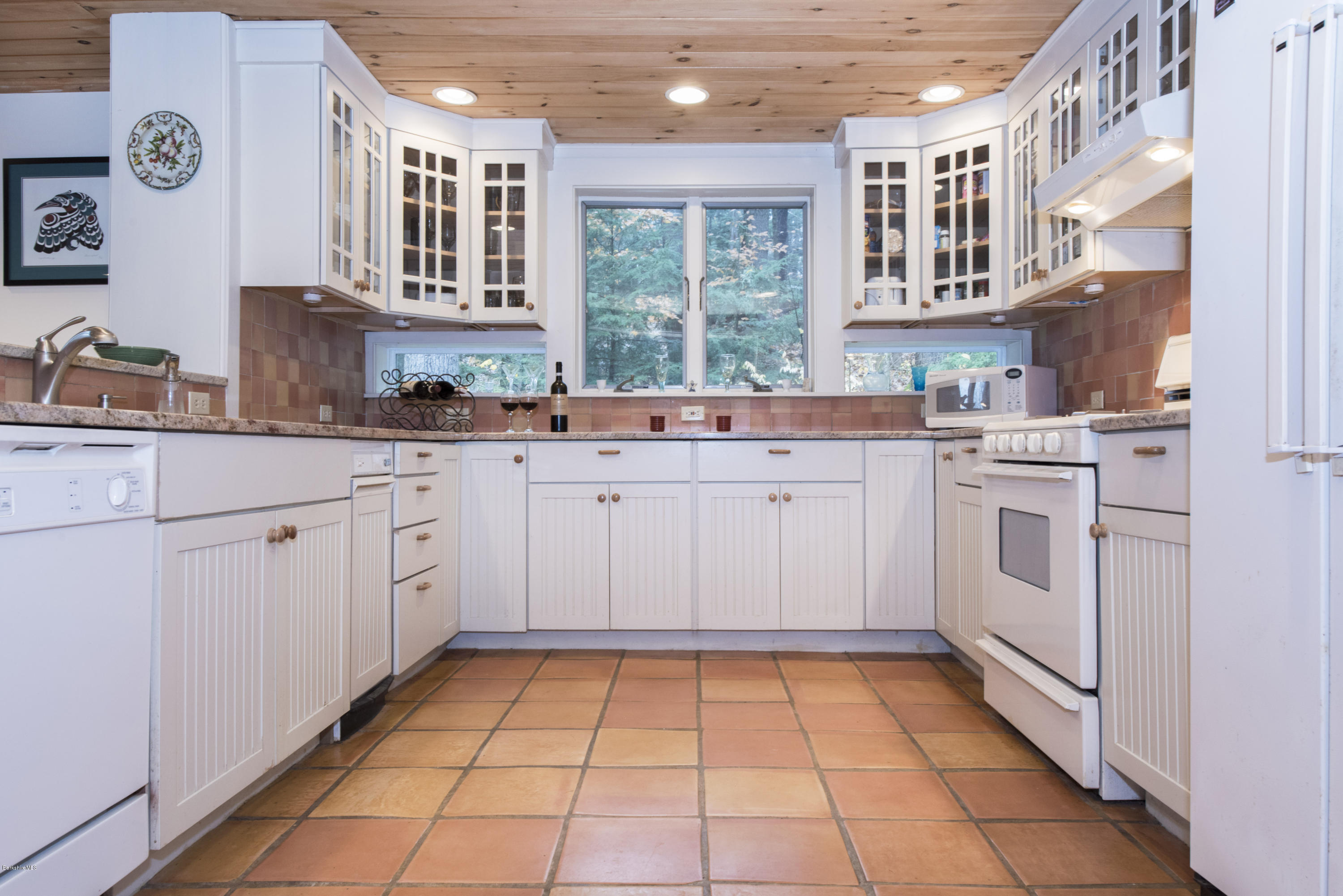 16 Bidwell Road Monterey, MA 01245 - Photo 14 of 40 a kitchen with a stove sink and cabinets