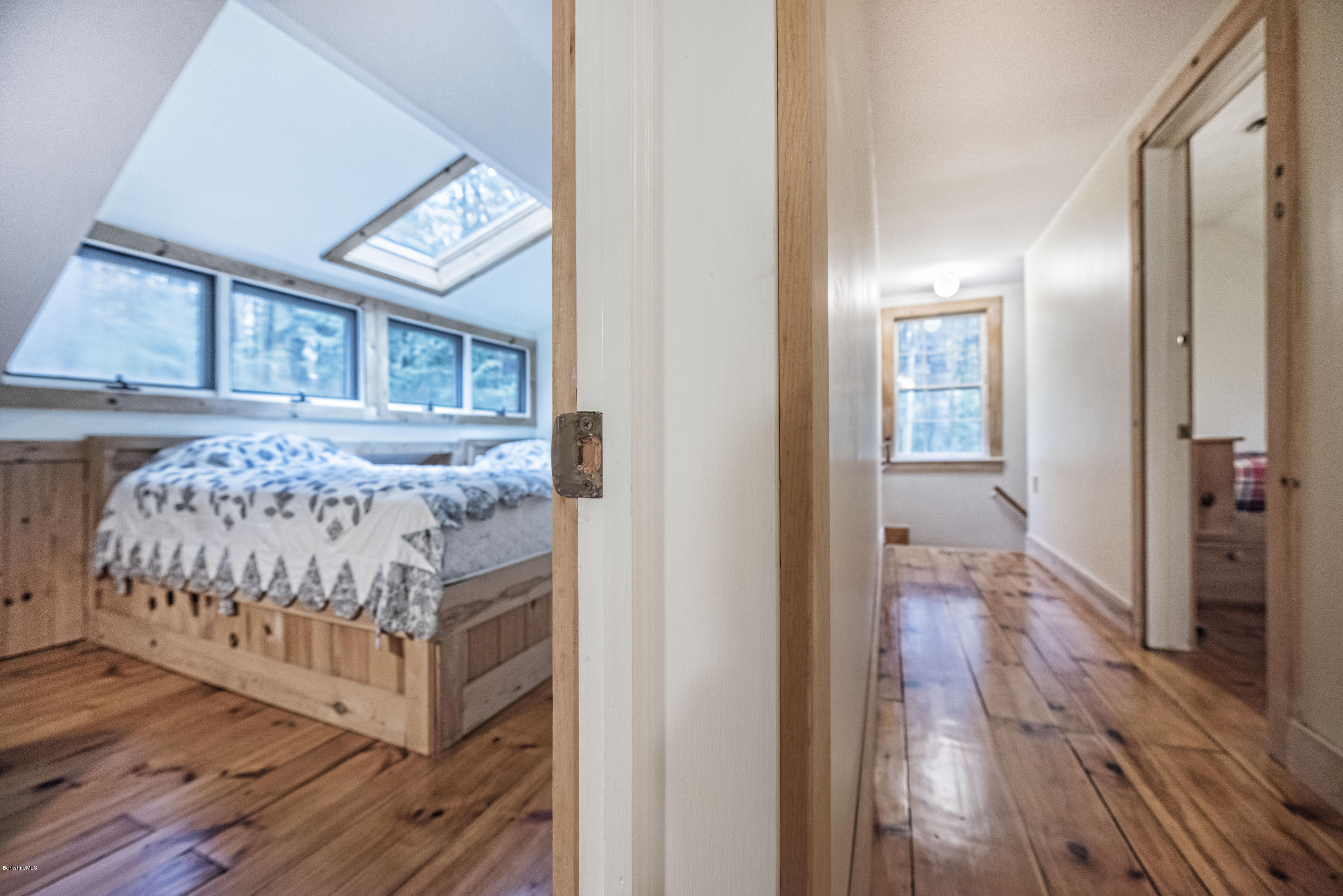 16 Bidwell Road Monterey, MA 01245 - Photo 23 of 40 a bedroom with a bed and wooden floor