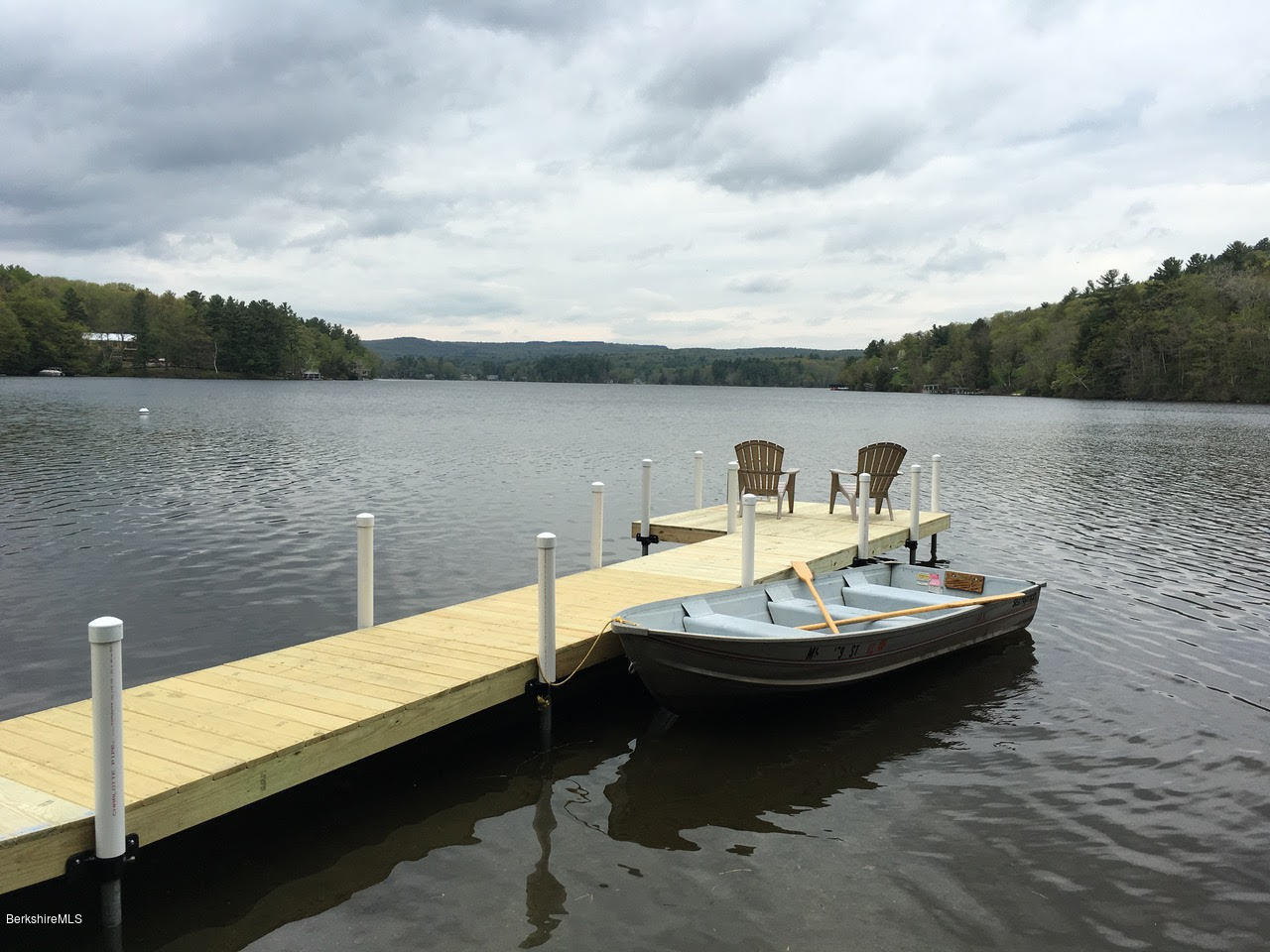 16 Bidwell Road Monterey, MA 01245 - Photo 34 of 40 a view of a lake with a table and chairs