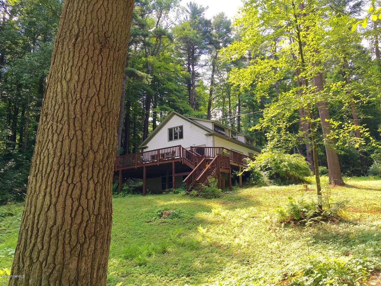 16 Bidwell Road Monterey, MA 01245 - Photo 6 of 40 a view of a house with a backyard