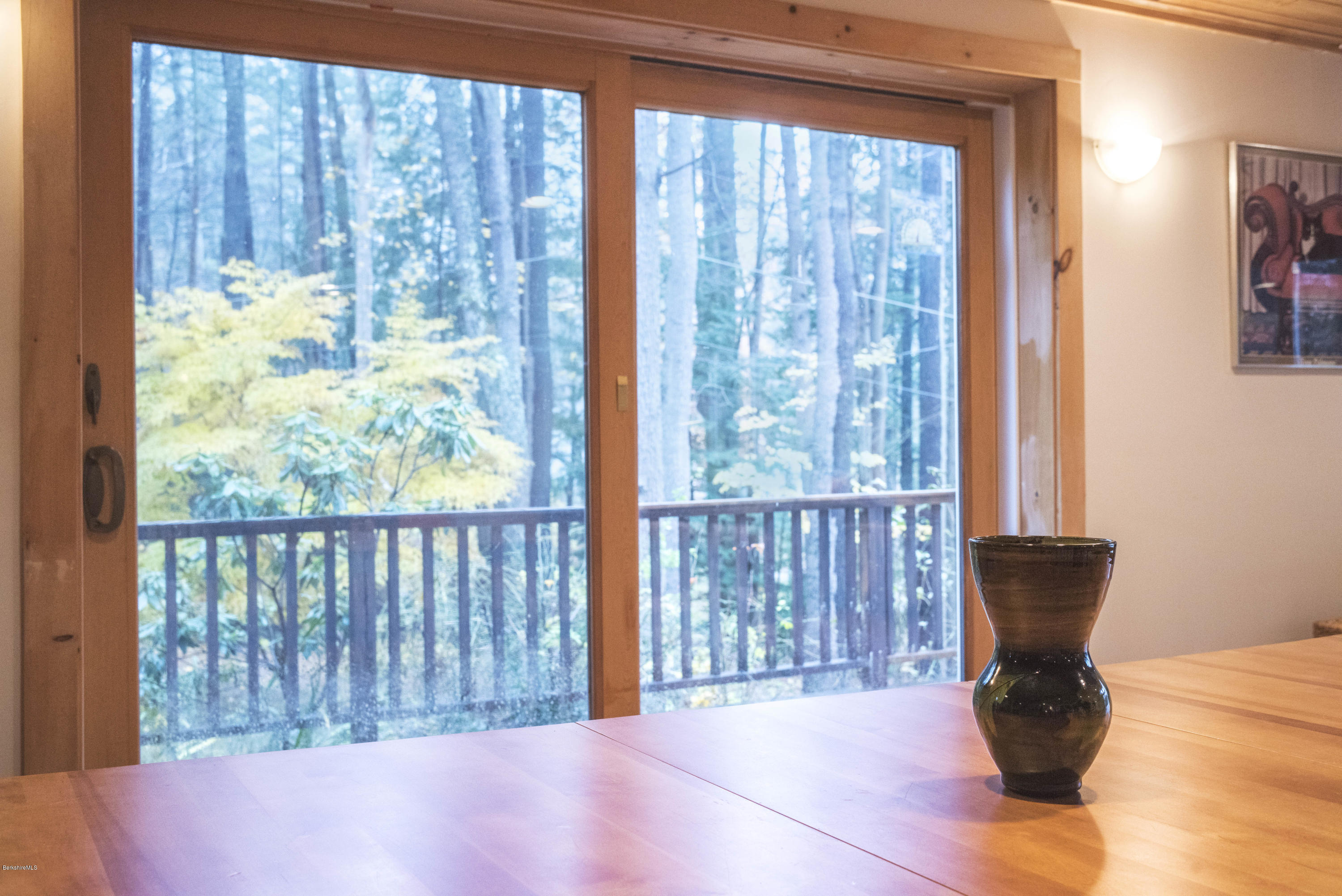16 Bidwell Road Monterey, MA 01245 - Photo 9 of 40 a view of a balcony with chair and table in front of it