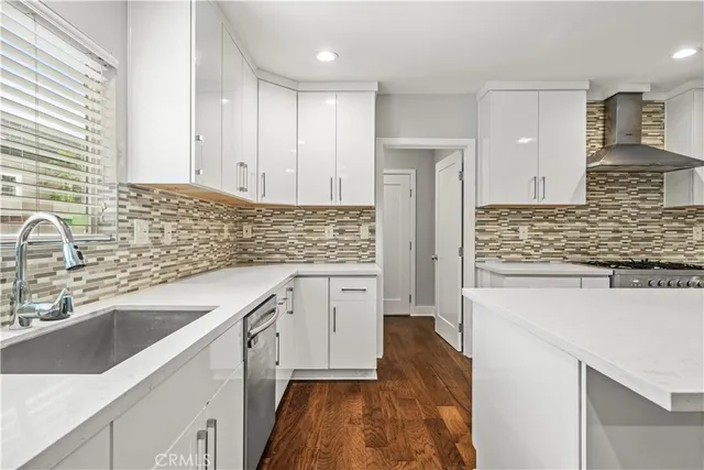 a kitchen with a sink stove and cabinets