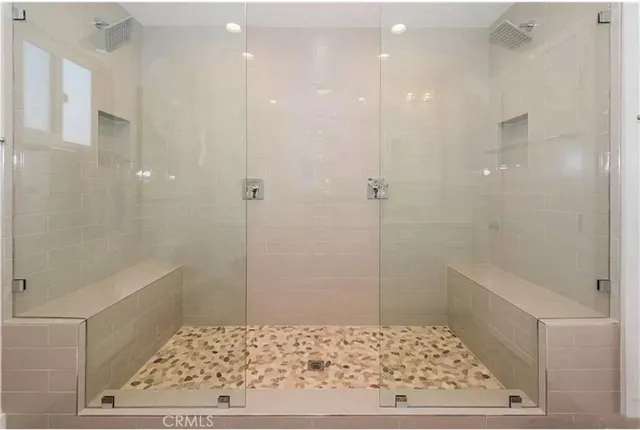 a bathroom with a tub and shower