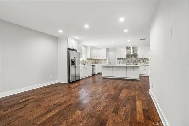 a view of kitchen with wooden floor