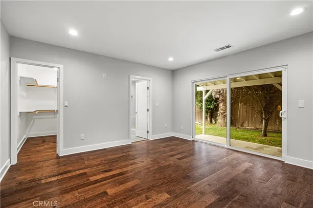 wooden floor in an empty room with a sliding door