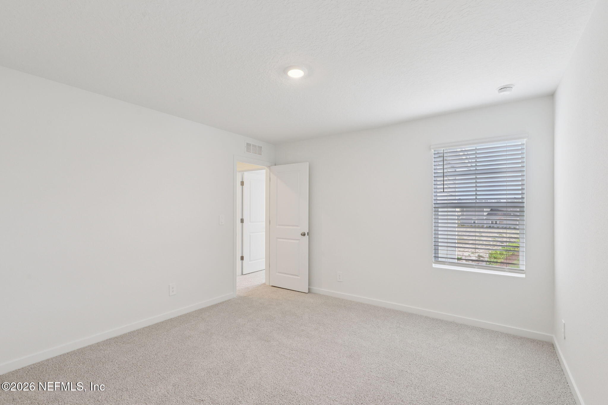 25 Rangeline Drive St. Augustine, FL 32092 - Photo 34 of 43 a view of an empty room with a window
