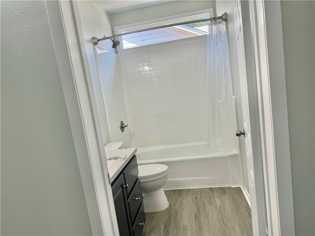 1805 3rd Street Corpus Christi, TX 78404 - Photo 13 of 26 a bathroom with a tub and toilet