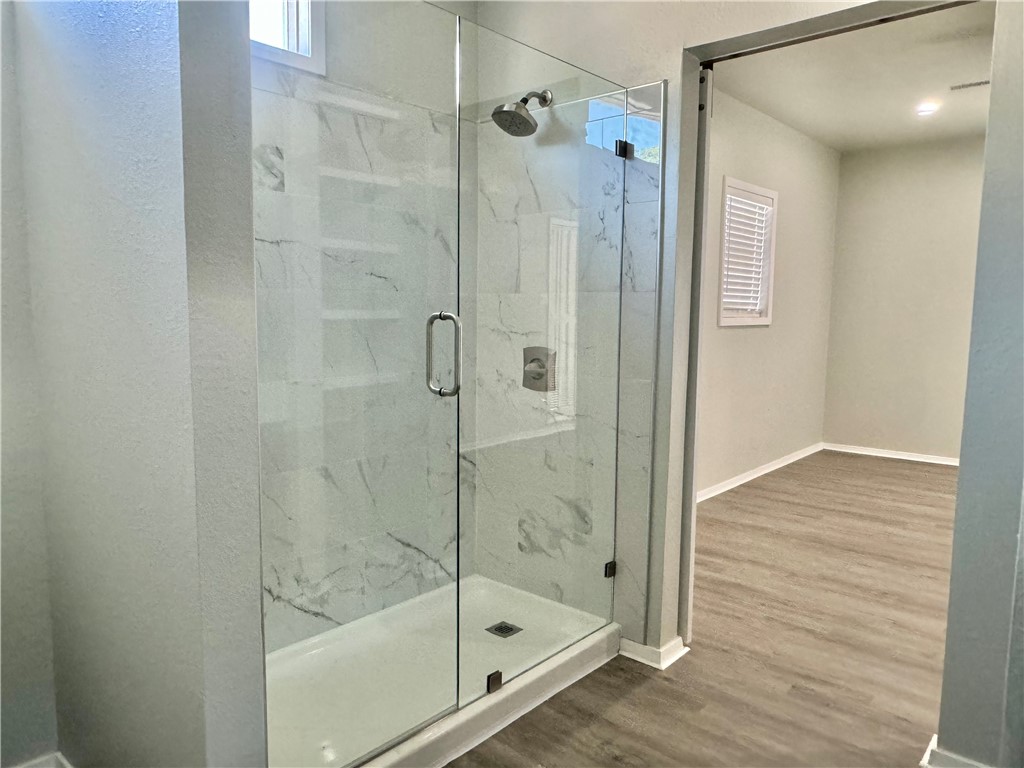 1805 3rd Street Corpus Christi, TX 78404 - Photo 20 of 26 a bathroom with a glass shower door