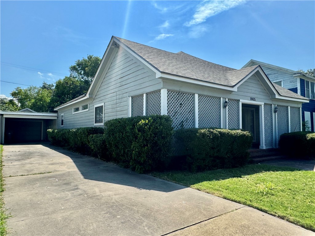 1805 3rd Street Corpus Christi, TX 78404 - Photo 2 of 26 a front view of a house with a garden