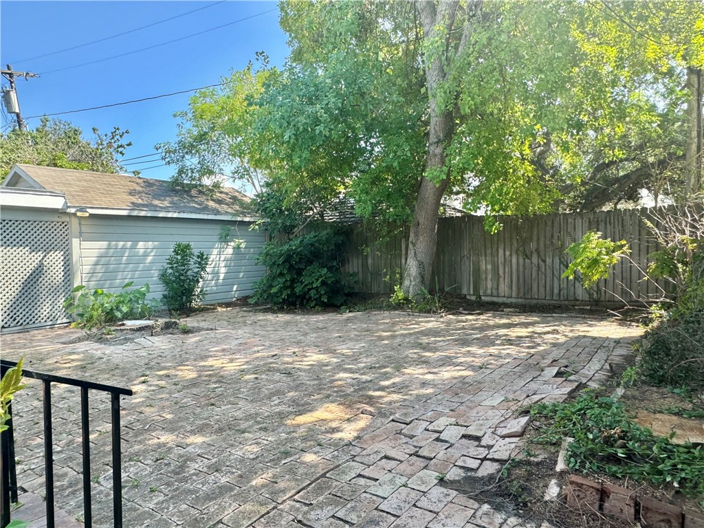 1805 3rd Street Corpus Christi, TX 78404 - Photo 23 of 26 a backyard of a house with plants and trees