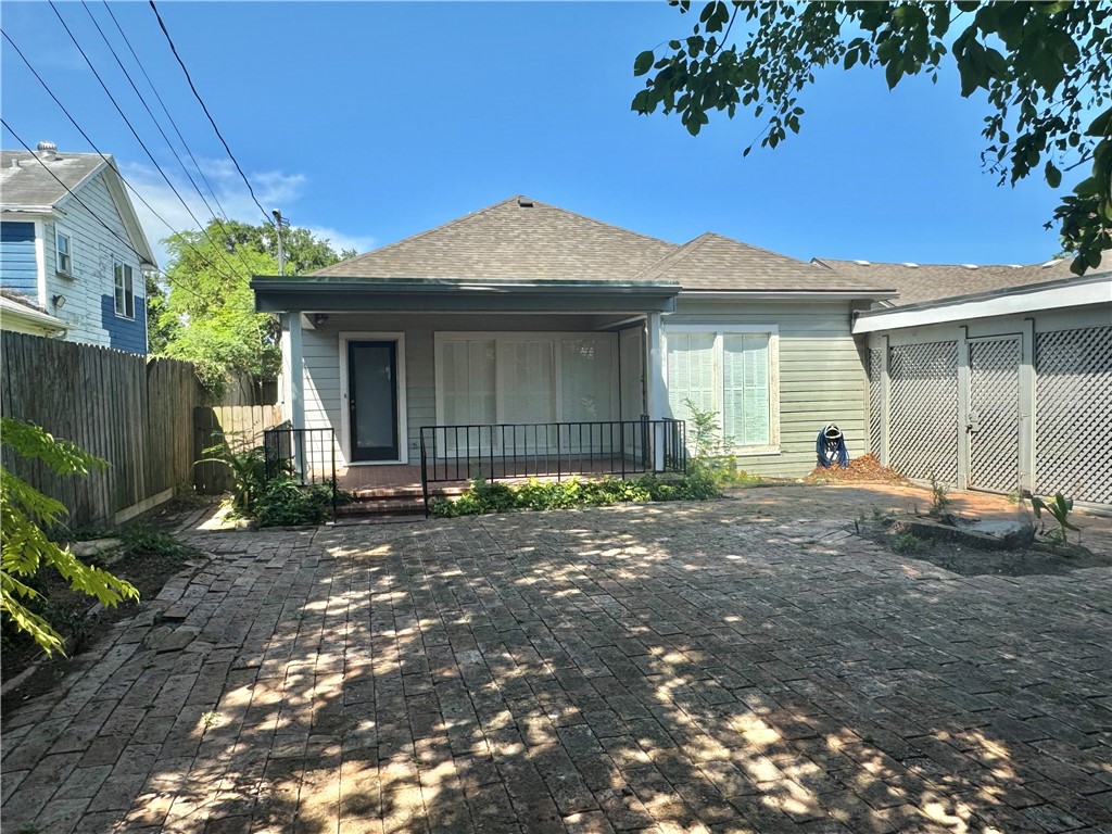 1805 3rd Street Corpus Christi, TX 78404 - Photo 24 of 26 a front view of a house with a yard and garage