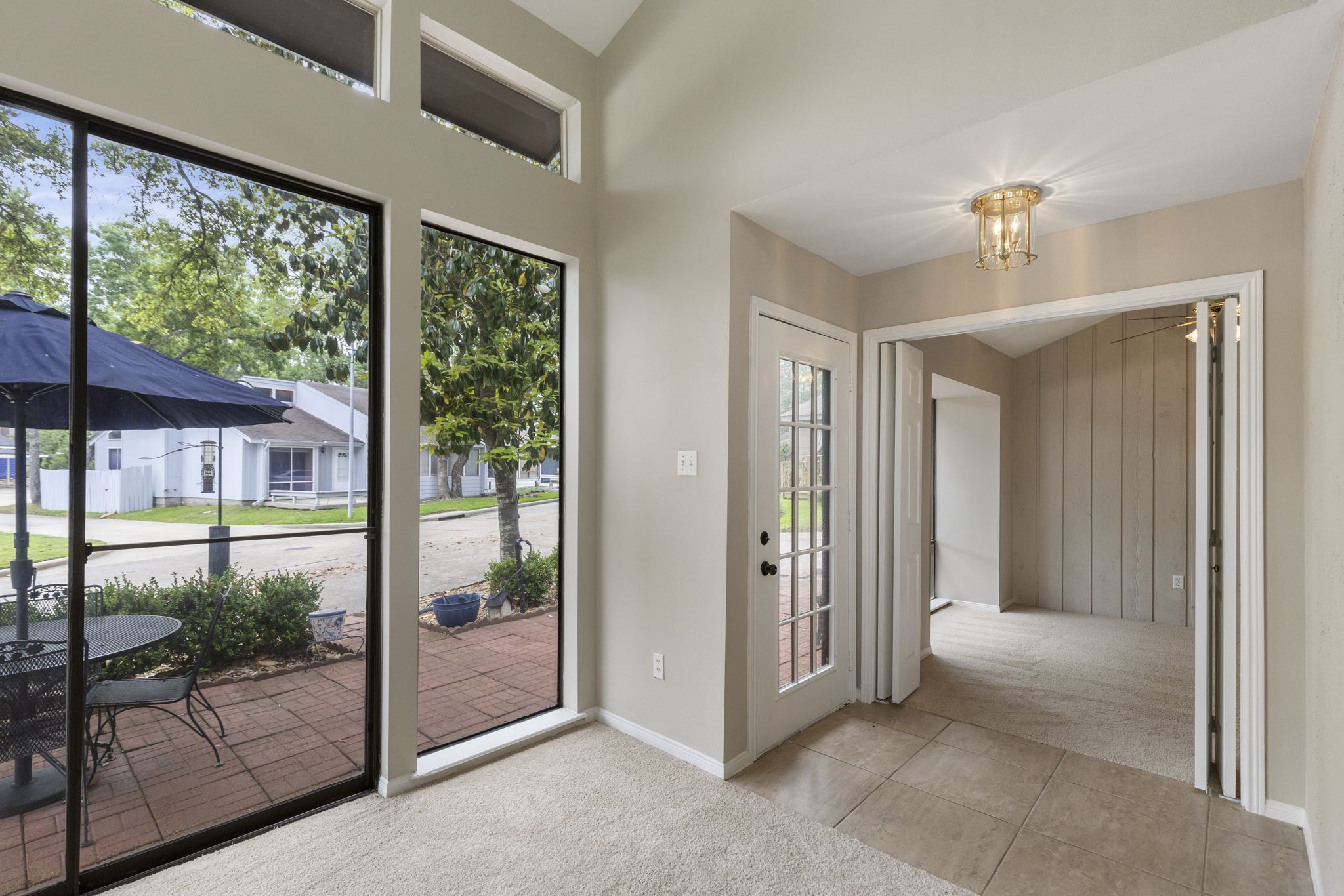 49 April Village Conroe, TX 77356 - Photo 6 of 46 a view of a room with a large windows and chandelier fan