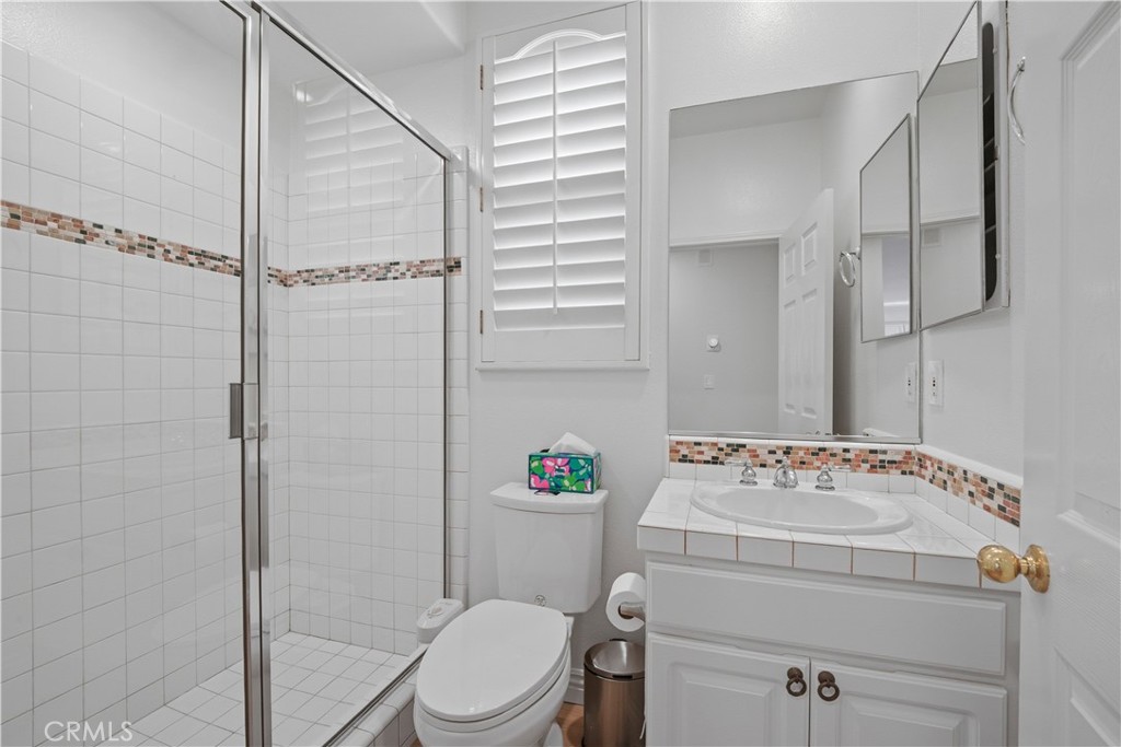 17 Bell Irvine, CA 92620 - Photo 11 of 24 a bathroom with a toilet sink vanity and shower