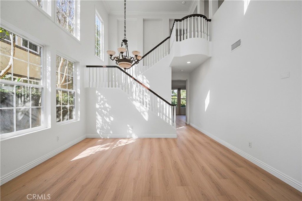 17 Bell Irvine, CA 92620 - Photo 3 of 24 a view of entryway with wooden floor