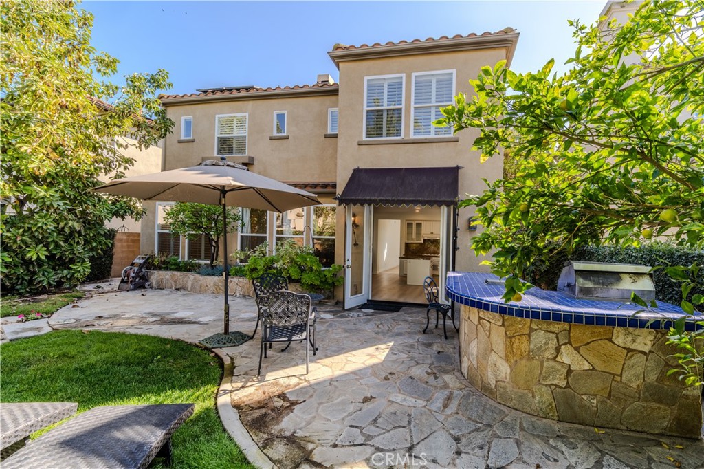 17 Bell Irvine, CA 92620 - Photo 9 of 24 a view of a house with backyard sitting area and garden