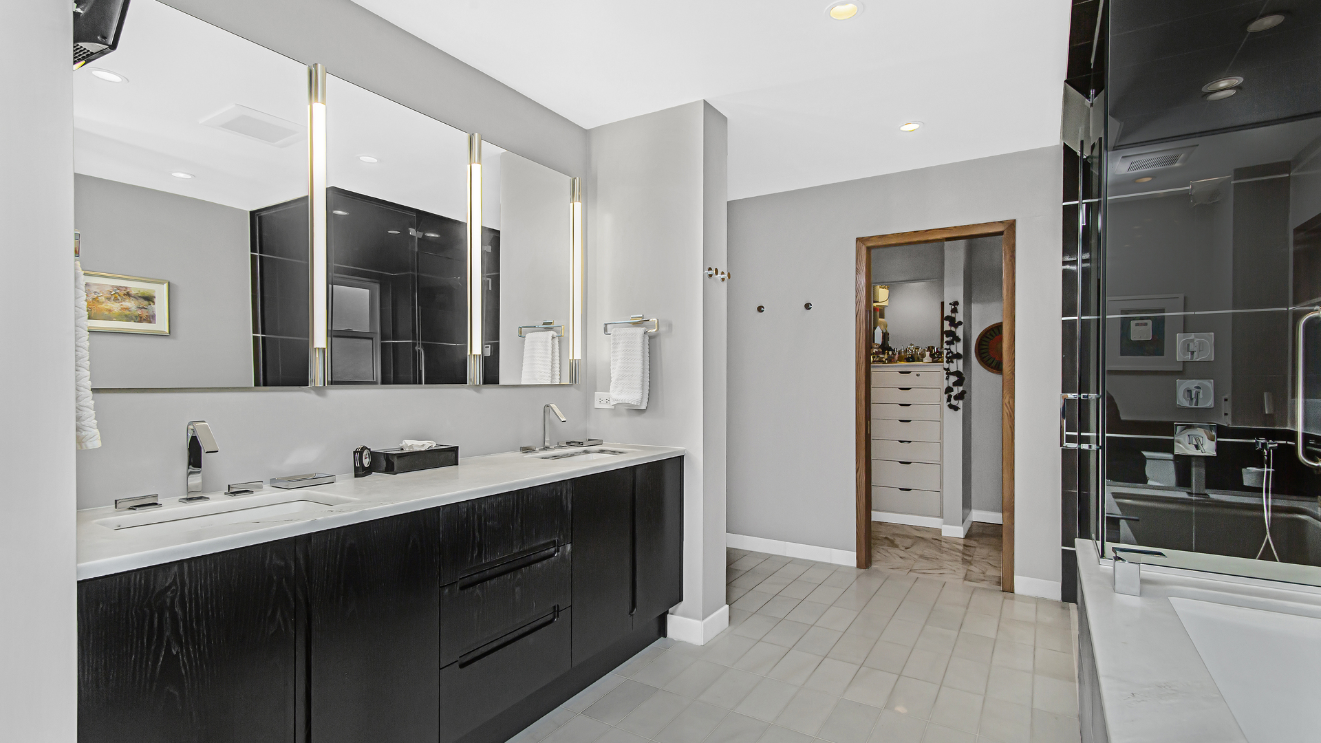 1182 Mayfair Lane Glencoe, IL 60022 - Photo 18 of 28 a bathroom with a double vanity sink a mirror and shower