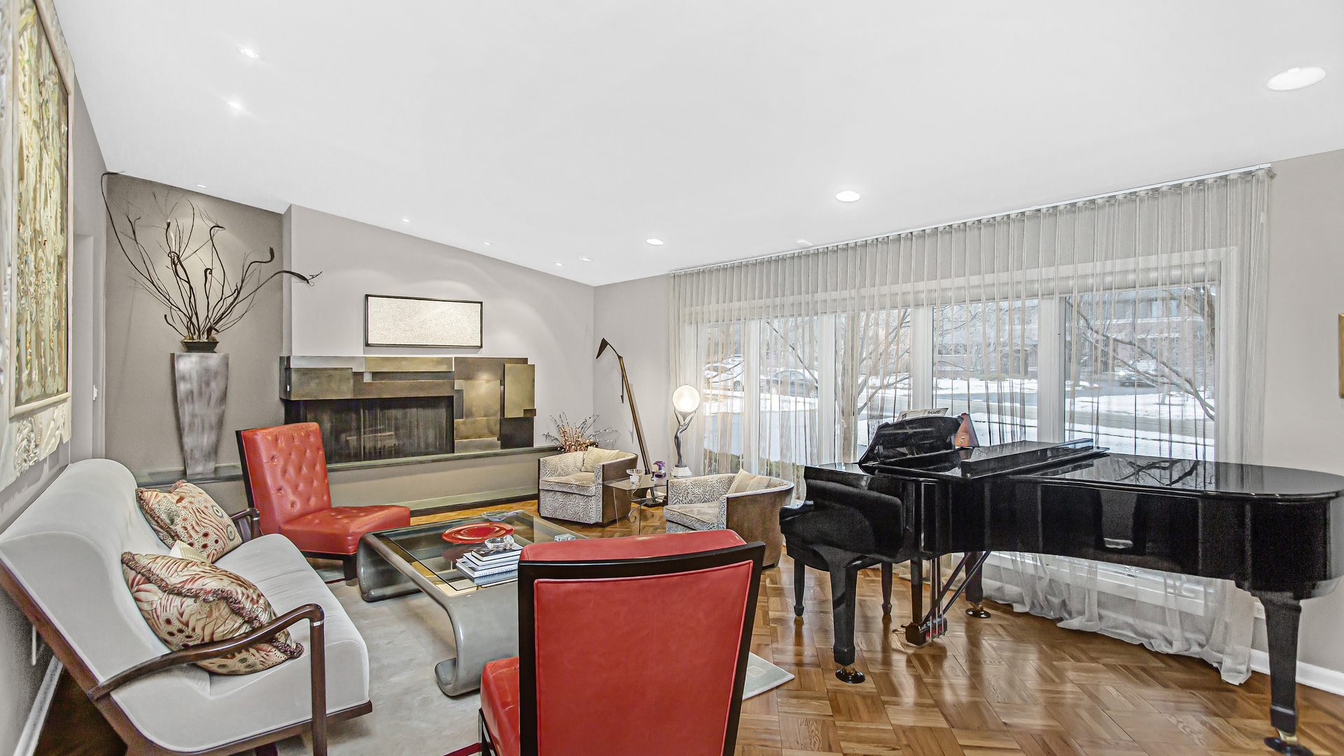 1182 Mayfair Lane Glencoe, IL 60022 - Photo 4 of 28 a living room with furniture a fireplace and large windows