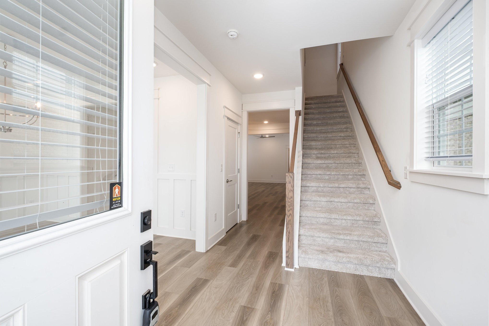 226 Sounder Circle La Vergne, TN 37086 - Photo 3 of 7 a view of a hallway with wooden floor and staircase