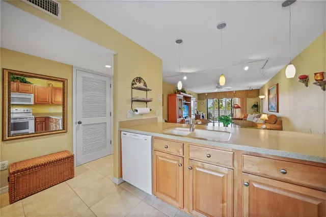 a kitchen with cabinets and window