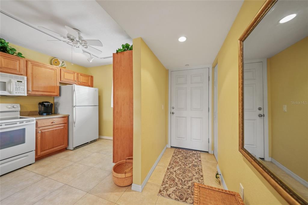175 Kings Highway, Unit 226 Punta Gorda, FL 33983 - Photo 13 of 41 a kitchen with refrigerator and window