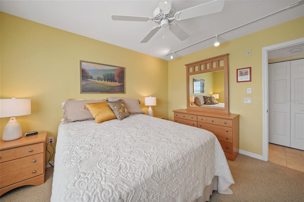 175 Kings Highway, Unit 226 Punta Gorda, FL 33983 - Photo 15 of 41 a bedroom with a bed and a chandelier