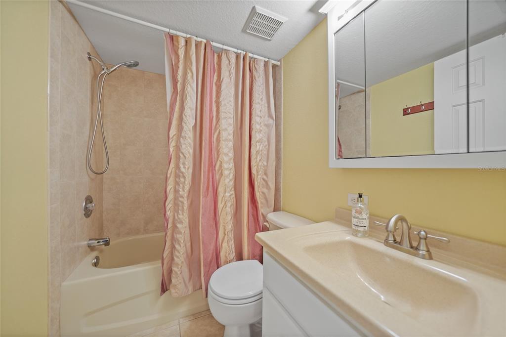 175 Kings Highway, Unit 226 Punta Gorda, FL 33983 - Photo 16 of 41 a bathroom with a sink a toilet and shower