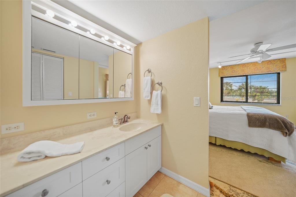 175 Kings Highway, Unit 226 Punta Gorda, FL 33983 - Photo 18 of 41 a bathroom with a granite countertop sink and a mirror