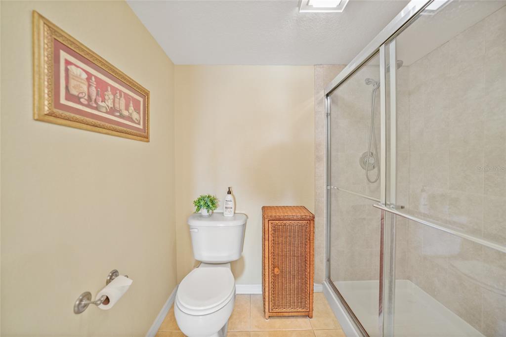 175 Kings Highway, Unit 226 Punta Gorda, FL 33983 - Photo 19 of 41 a white toilet sitting next to a bathroom sink