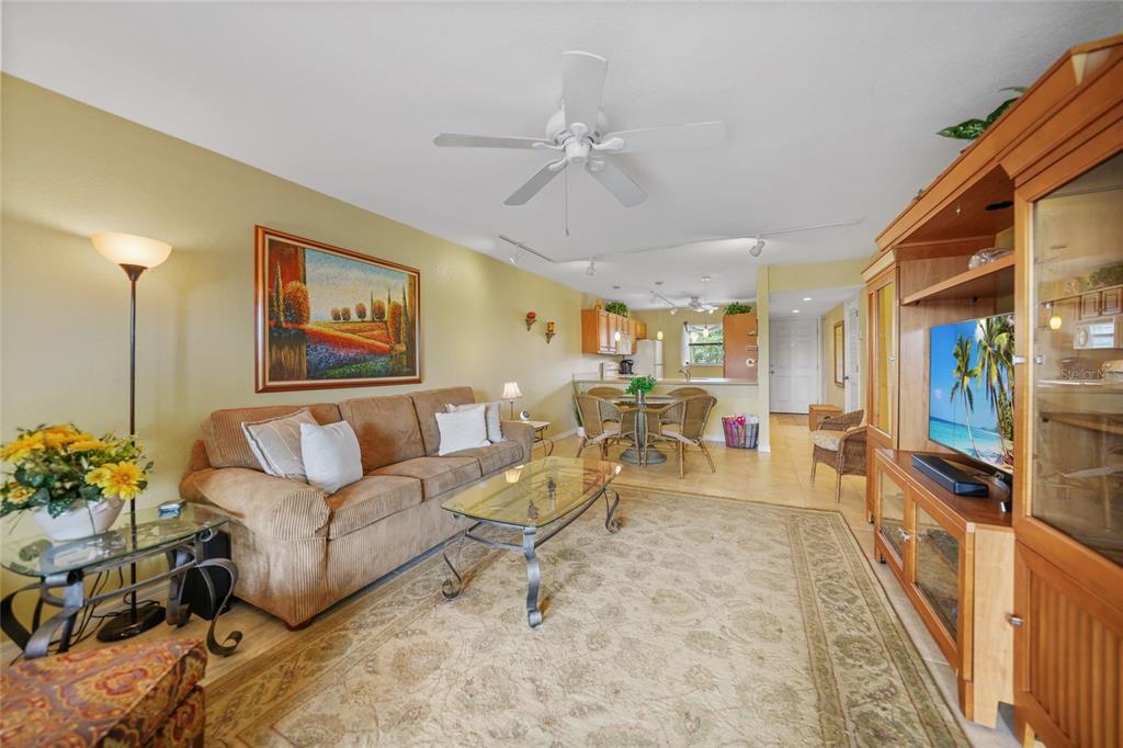 175 Kings Highway, Unit 226 Punta Gorda, FL 33983 - Photo 2 of 41 a living room with furniture and a flat screen tv