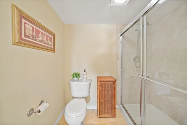 a white toilet sitting next to a bathroom sink