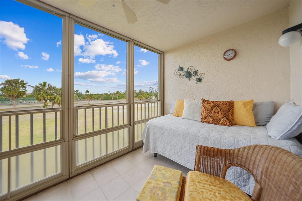 175 Kings Highway, Unit 226 Punta Gorda, FL 33983 - Photo 23 of 41 a bedroom with a bed and a large window