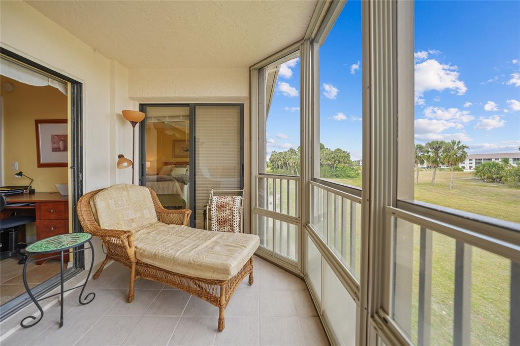 175 Kings Highway, Unit 226 Punta Gorda, FL 33983 - Photo 24 of 41 a living room with furniture and a floor to ceiling window