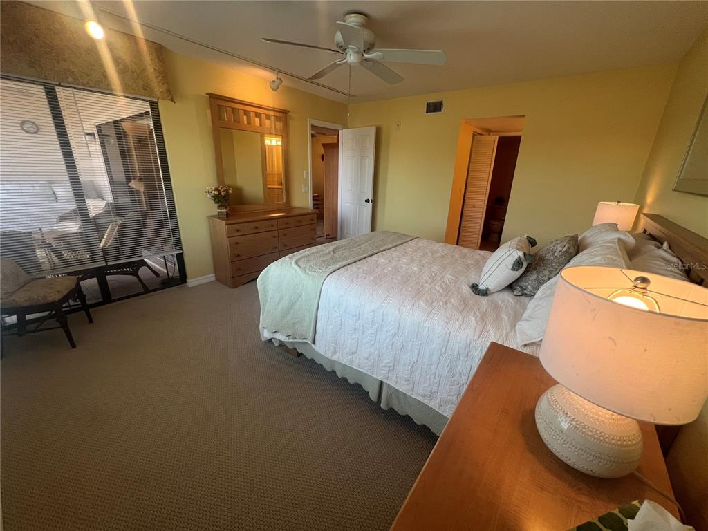 175 Kings Highway, Unit 226 Punta Gorda, FL 33983 - Photo 39 of 41 a bedroom with bed and a mirror