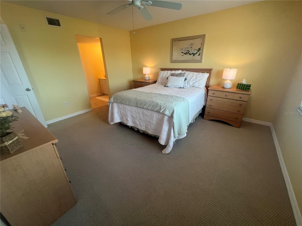 175 Kings Highway, Unit 226 Punta Gorda, FL 33983 - Photo 40 of 41 a bedroom with a bed and painted walls