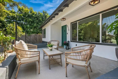 a view of a chair and table in the balcony