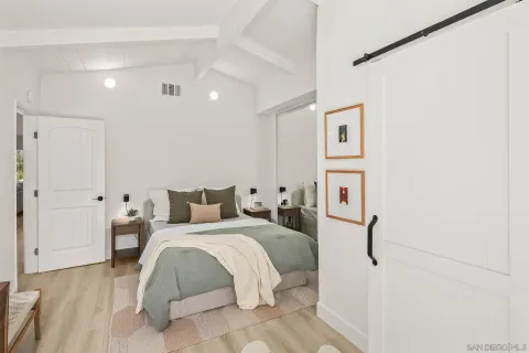 a bedroom with a bed and a closet