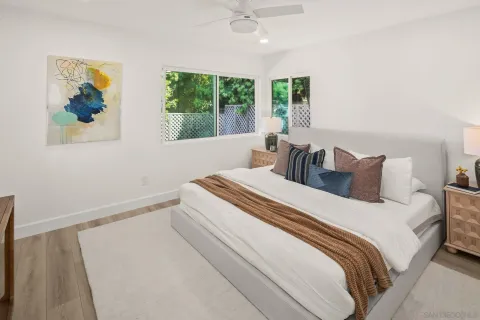 a bedroom with bed and window