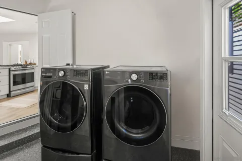 a view of a hallway with washer and dryer