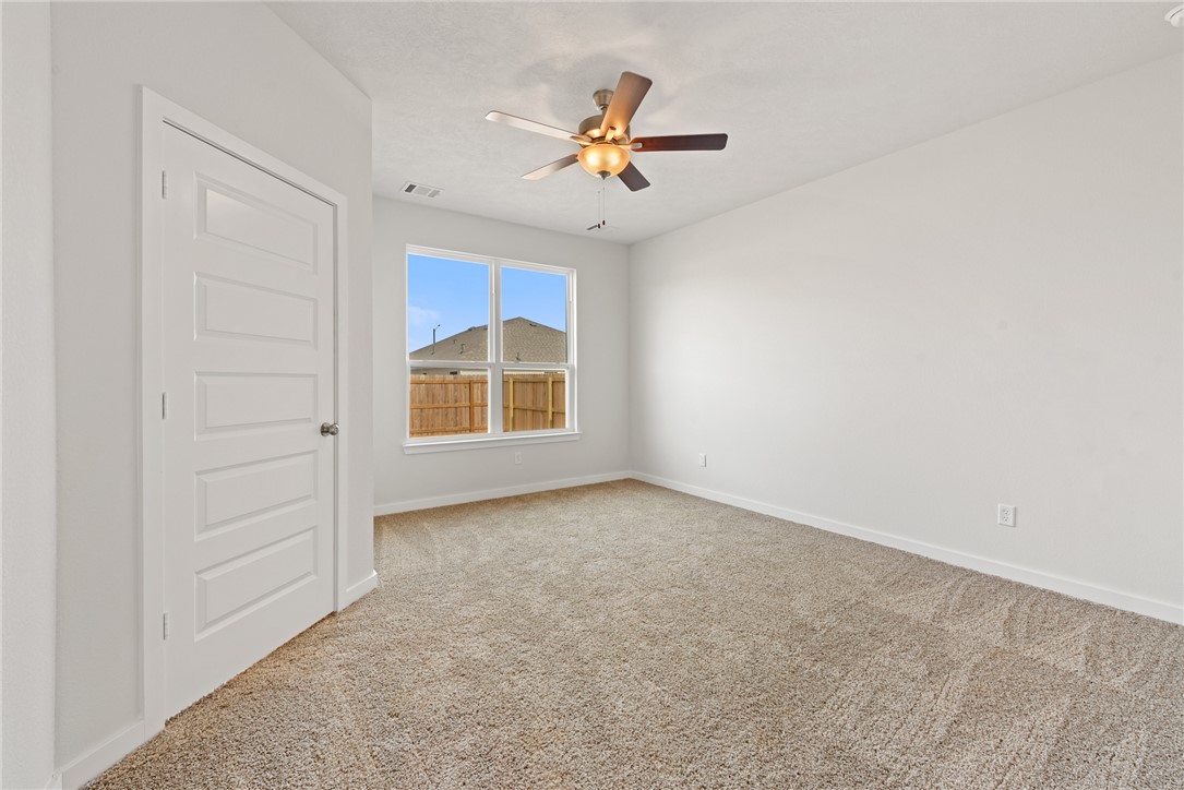 2412 Rooke Road Bryan, TX 77807 - Photo 19 of 35 an empty room with closet and fan