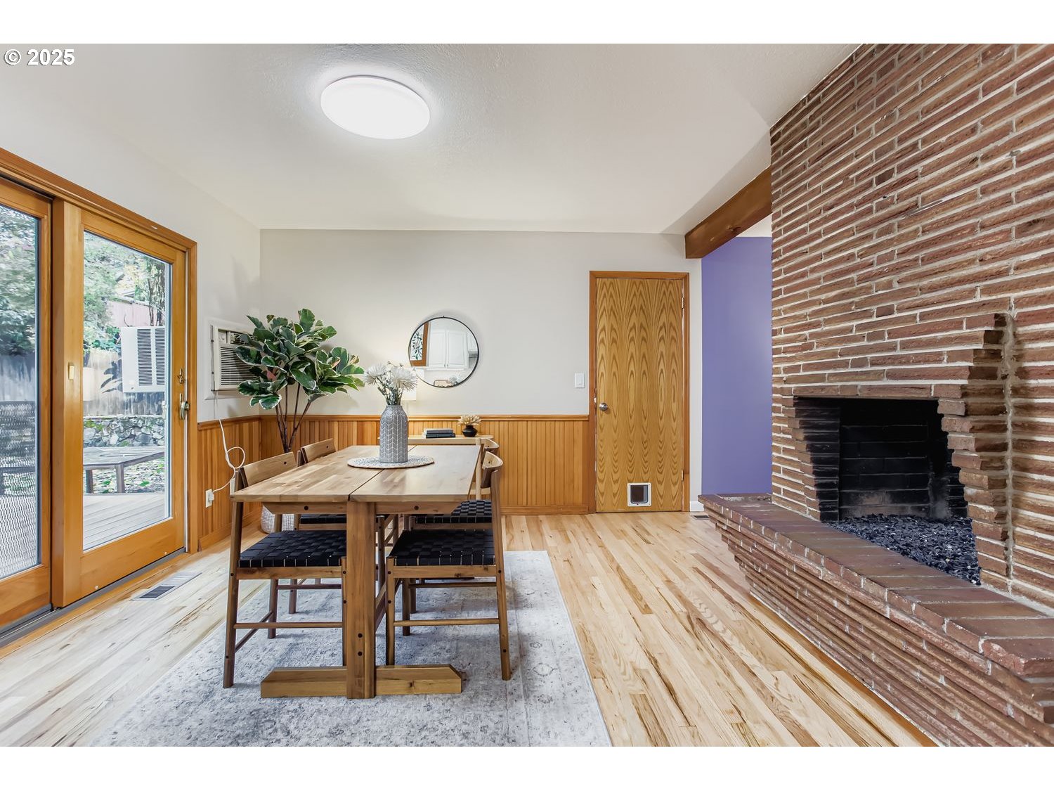 6405 Southwest Radcliff Street Portland, OR 97219 - Photo 6 of 26 a living room with furniture a window and a fireplace