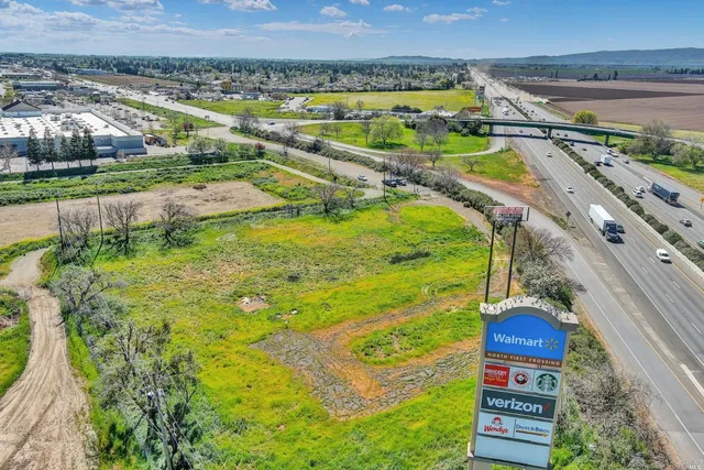 a view of a yard with a swimming pool
