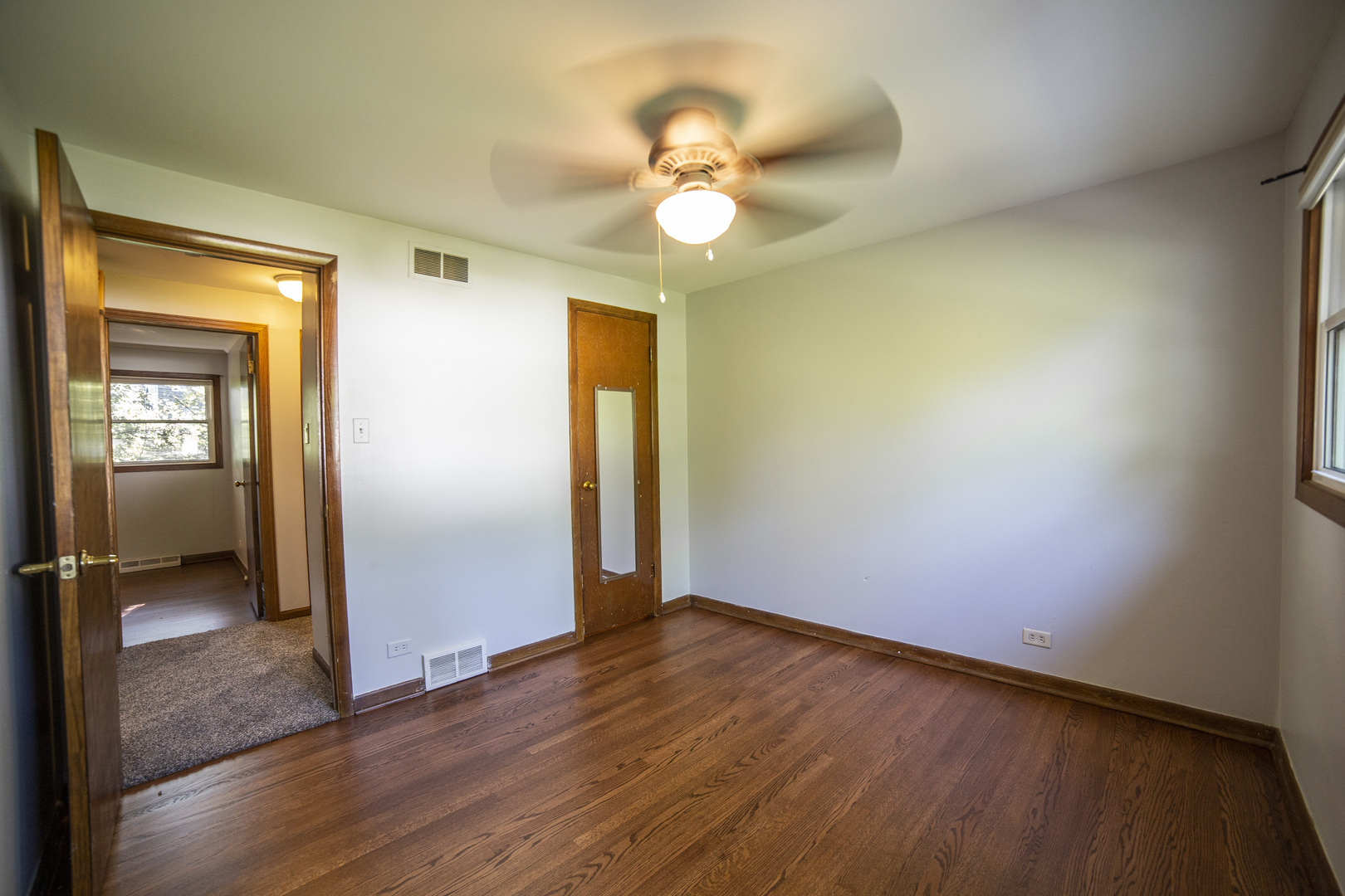 1222 Hickory Road Homewood, IL 60430 - Photo 11 of 29 wooden floor in an empty room with a window
